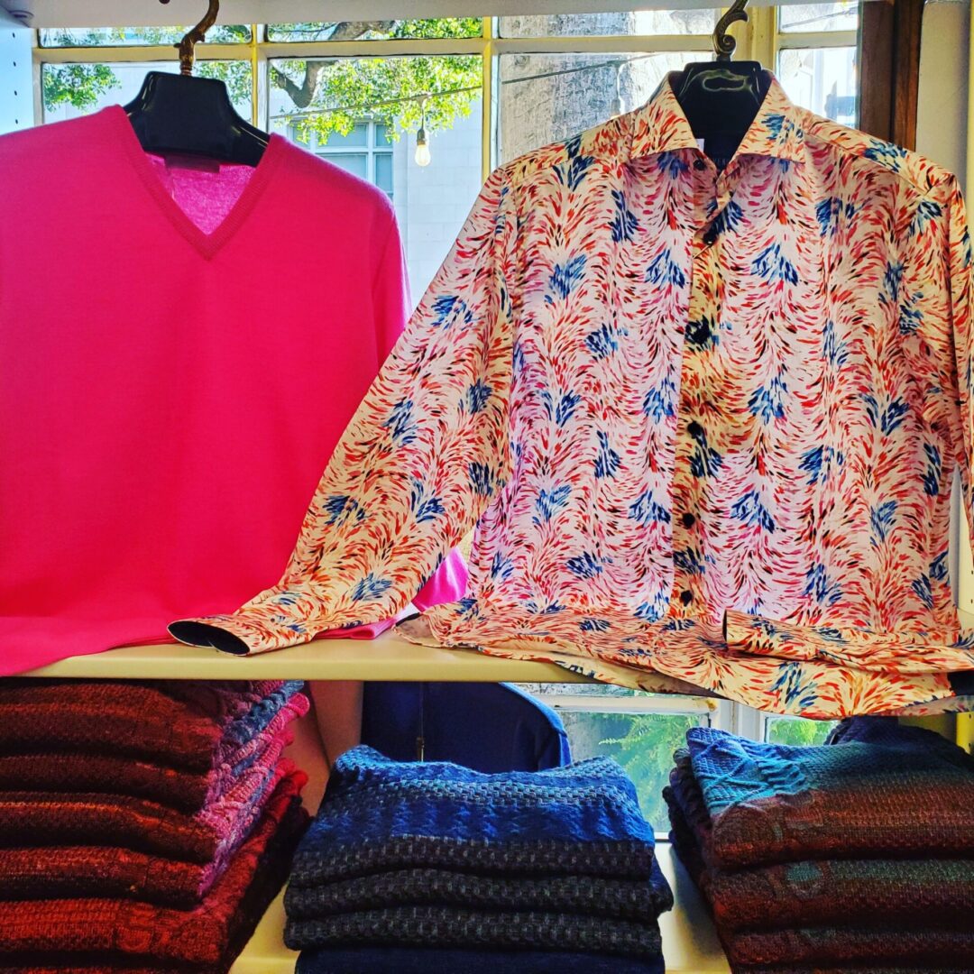 A display of shirts and pants on mannequins.